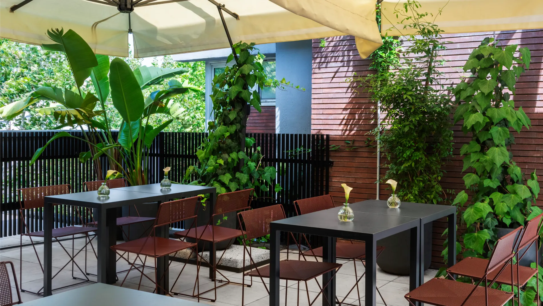Green terrace with tables beneath large parasols - Parioli Cube Hotel, BZAR hotels in Rome