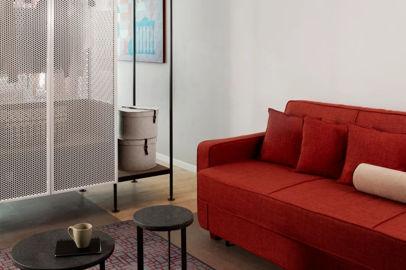 Junior Suite sitting area with red sofa and side tables - Parioli Cube Hotel, BZAR hotels in Rome
