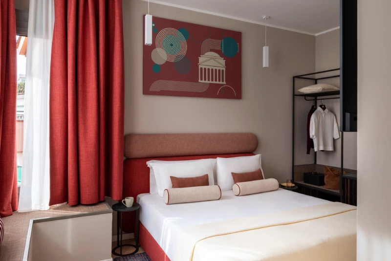 Superior room with double bed, red curtains and open wardrobe - Parioli Cube Hotel, BZAR hotels in Rome